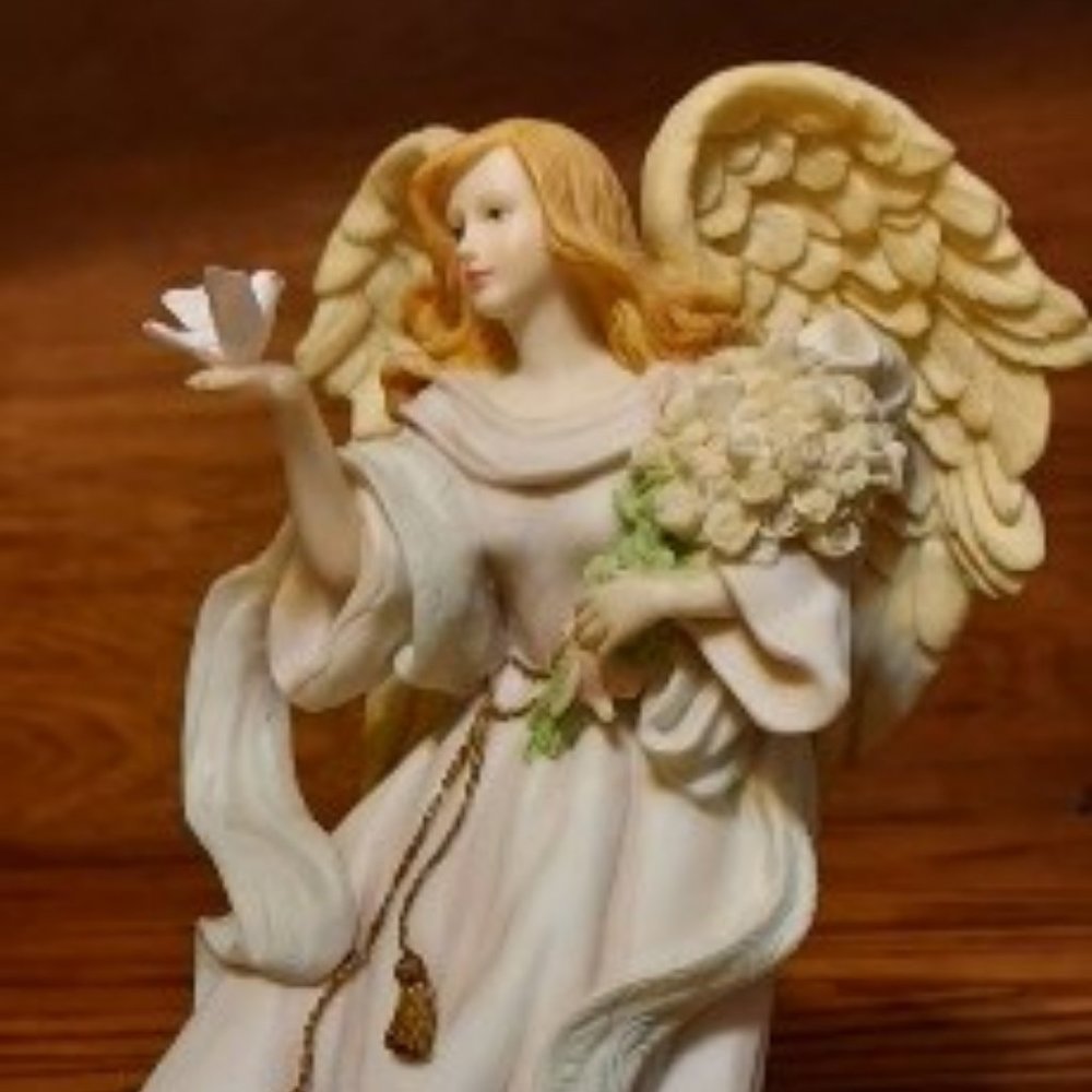 BEAUITFUL ANGLE HOLDING FLOWERS AND A BIRD IN HER HAND